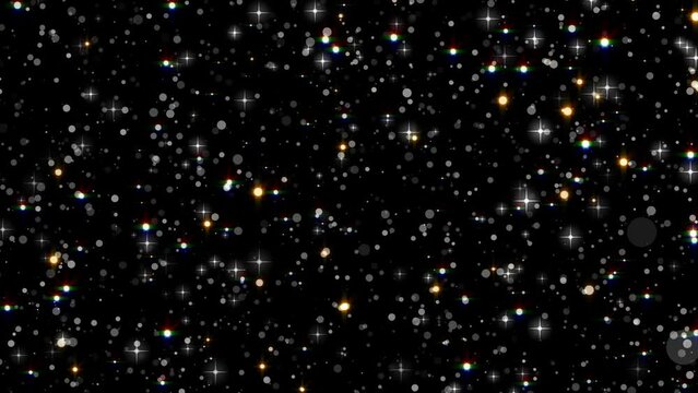 Sparkling, shining glitter background, slowly moving on bokeh, particles and stars on black background.