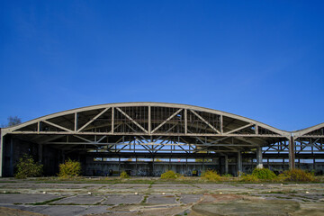 Obraz premium Metal structures German air hangars, abandoned military airfield Notif on Baltic spit.