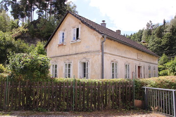 A traditional house with garden and fence in Lusatian mountains at Prysk, Czech republic
