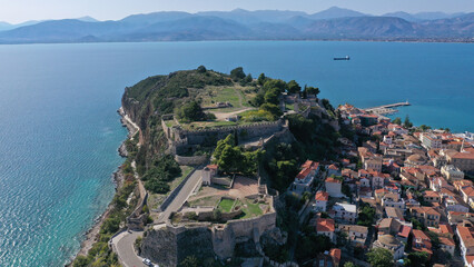 Aerial drone photo of famous scenic fortified rock known as Acronafplia overlooking old city of Nafplio, Argolida, Peloponnese, Greece