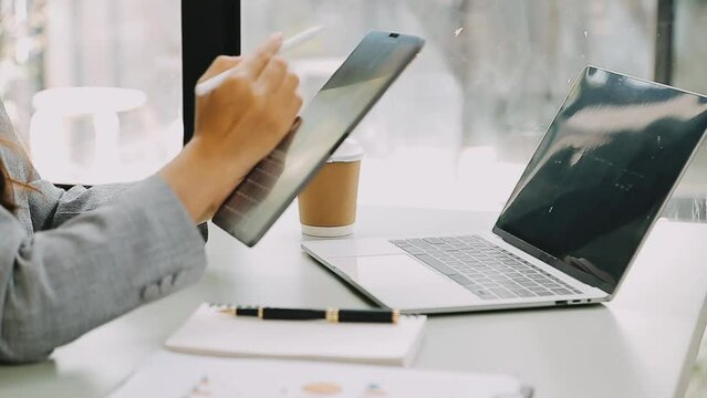 Businessman working with smart phone and laptop and digital tablet computer in office with digital marketing media in virtual icon	