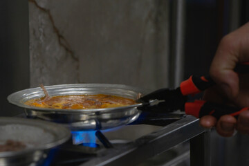 Spicy 'Beyran soup'' is  boiling on the gas stove..
