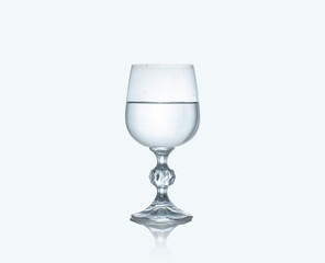 Wine glass filled with water isolated on white background.