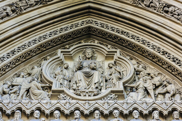 Fototapeta na wymiar Statues on the facade of the Westminster Abbey Cathedral in London, England