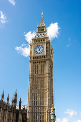 The famous Big Ben clock tower against a blue sky in London, England