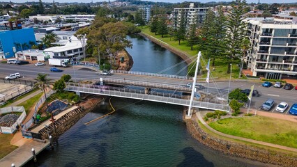 Fototapeta premium Aerial view of the bridge and streets of Port Macquarie on a sunny day in NSW, Australia