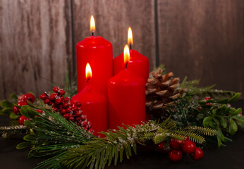 Advent - four red candles with a Christmas ornament. Fourth candle, Angel's candle