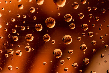 The effect of rain on a colored background.