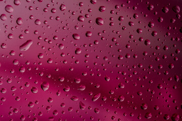 The effect of rain on a colored background.