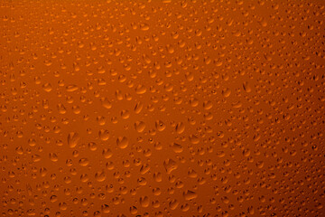 The effect of rain on a colored background.