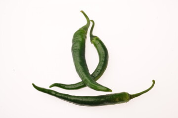 three green chili pepper isolated on white background