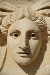 Fototapeta na wymiar Ancient Mask Relief in Aphrodisias Ancient City in Aydin, Turkiye