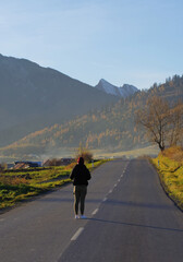 Fototapeta premium Female photographer taking photos while traveling in the Tatra Mountains in Slovakia.