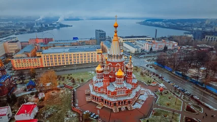 Foto op Plexiglas St. Michael the Archangel Cathedral. Aerial View. Beautiful cathedral with golden domes. The main architectural landmark of Izhevsk, Russia. Popular tourist destination. Izhevsk Pond in the background © Adsloboda