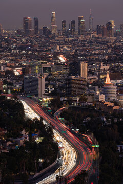 The 101 freeway leading into the downtown Los Angeles skyline at dusk