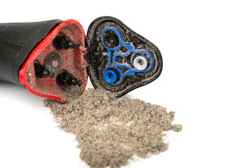 Electric shaver with three open shaving heads and shavings