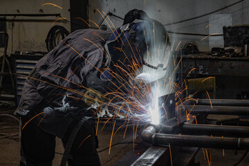 Welder erecting technical steel