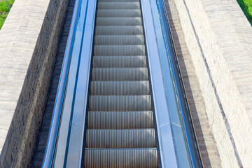 Electric escalator entrance, electric stair to transit up or down.