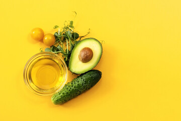Ingredients of healthy food. Micro green pea sprouts, olive oil, cucumber, tomato, avocado. Ketogenic low carbs diet concept.