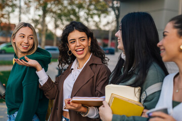 Friends discussing lecture out of the college building
