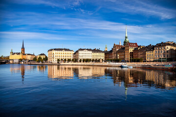 Scenic panoramic view of Gamla Stan in Old Town Stockholm, embankment capital of Sweden with blue sky. Background of amazing urban scenery view of Scandinavian swedish architecture. Copy text space