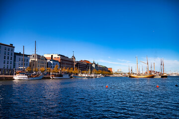 Scenery panorama view city embankment of Helsinki with boats, capital of Finland with blue morning sky. Background of amazing urban scenic view of finnish architecture and Gulf of Finland. Copy space