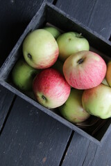 Ripe apples in a wooden vintage crate.