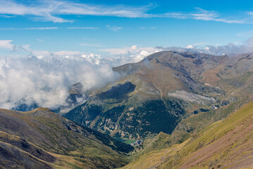 High landscape with clouds and blue sky.