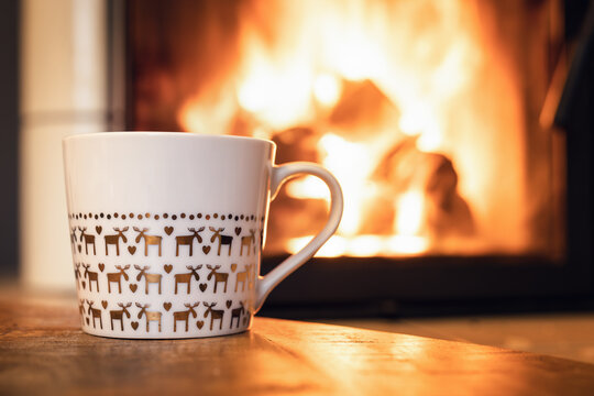 Reindeer cup in front of fireplace