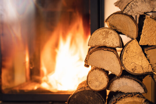 Firewood stack in front of stove.