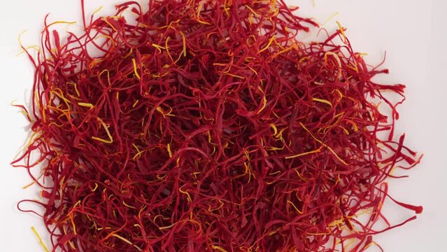 Heap of Moroccan saffron isolated on white background.