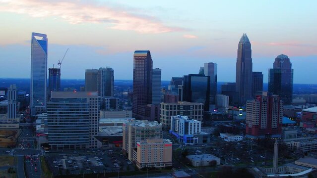 Aerial Shot Of Modern Downtown In Residential City, Drone Flying Backwards During Dusk - Charlotte, North Carolina