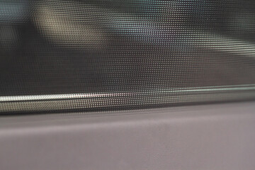 Closed sunshade. Car side window curtains sunshades. Sunblind curtain in a modern car.
