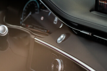 Engine start button. Close up engine car start stop button. Modern car interior details.