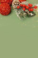 Christmas, New year's decorations, red star and ball on a green background. Flat lay