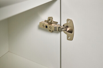 Hinge cabinet of kitchen cupboard door metal furniture isolated on white background, hardware on...