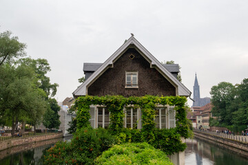House surrounded by two canals and with a green area in front
