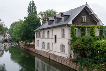 Obraz premium House surrounded by two canals and with a green area in front