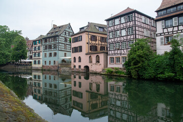 Colored houses in a French village along a canal in the Alsace area