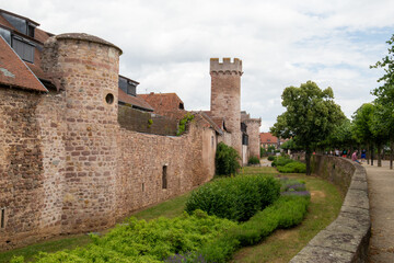 Fototapeta na wymiar Castle in a village in France in the Alsace area, surrounded by trees