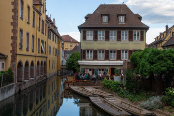 Fototapeta na wymiar Small village in France with water canals surrounding the houses in the Alsace area