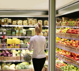 Woman buying fruits and vegetables at the market