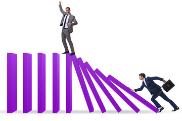 Businessman in domino effect concept
