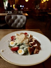 Caesar salad with chicken in a plate