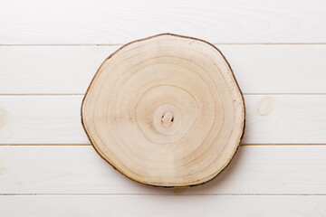 Top view of wooden serving tray on wooden background. Empty space for your design