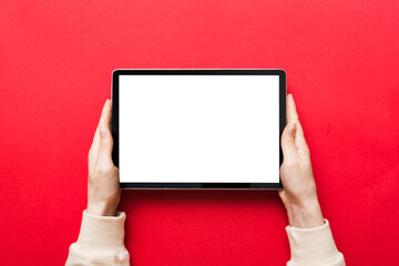 female teen hands using tablet pc with white screen, Mockup image of woman hand holding white tablet pc with blank white screen at home