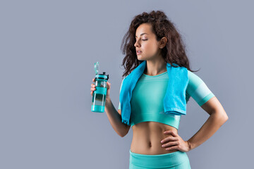 fitness sportswoman with sport towel and bottle, copy space. fitness sportswoman