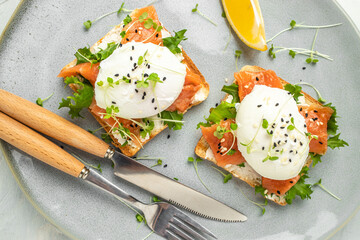 Toast with salmon, poached egg and avocado guacamole, Ketogenic diet. Low carb high fat breakfast. Healthy food concept. place for text, top view