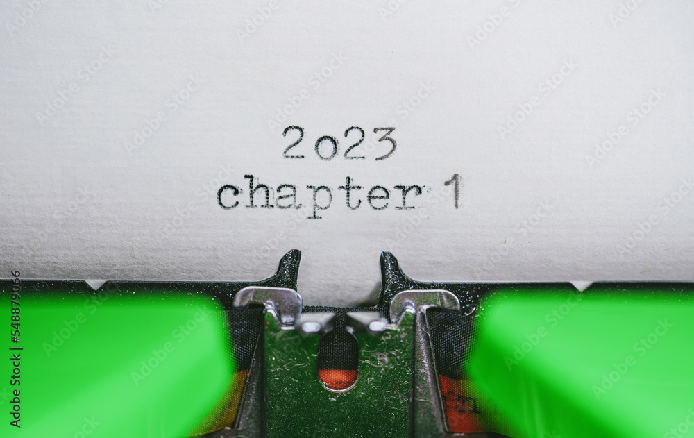 Aufkleber old typewriter with following text on paper - 2023 chapter one. new years concept