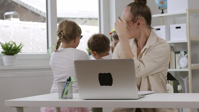 Young mother is working at laptop. Homeoffice